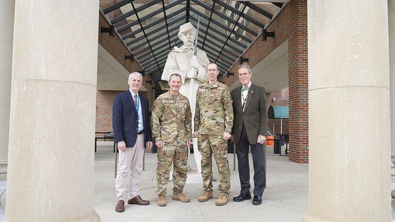 From left: Dr. Bradley Lloyd (retired U.S. Air Force colonel), Dayton VA Medical Center, assistant chief of staff; Dr. (Maj.) Matthew Koroscil, director of the Medical Intensive Care Unit, Wright-Patterson Medical Center; Dr. (Maj.) Andrew Berglund, chief of Pulmonary Medicine, Wright-Patterson Medical Center; and Dr. James Hardy, (retired U.S. Army colonel), Dayton VA Medical Center chief of staff stand outside the Dayton VA in celebration of their resource-sharing partnership that has increased care for veterans at the downtown facility. U.S. AIR FORCE PHOTO/KENNETH STILES