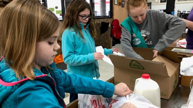 Local residents gave a Darke County grocery a helping hand on Saturday, Nov. 23. CONTRIBUTED