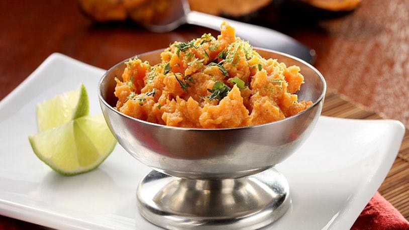 Ember-roasted mashed sweet potatoes with coconut and lemongrass will break you out of your veggie funk in no time. (Michael Tercha/Chicago Tribune/TNS)