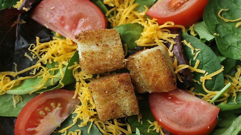 Stove top croutons garnish a salad. (J.B. Forbes/St. Louis Post-Dispatch/TNS)