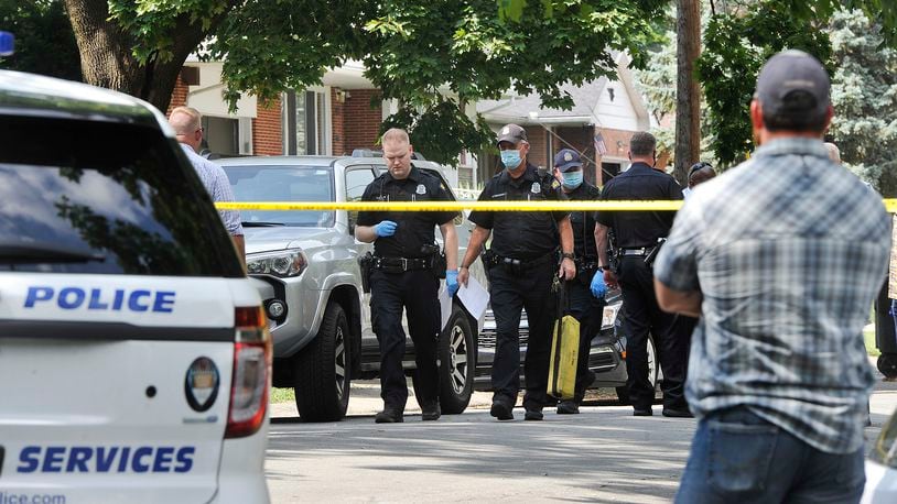 Police responded to the intersection of West Hillcrest Avenue and Mayfair Road in Dayton shortly before 2 p.m. Monday after a caller reported a man had been shot in a black car. MARSHALL GORBY/STAFF