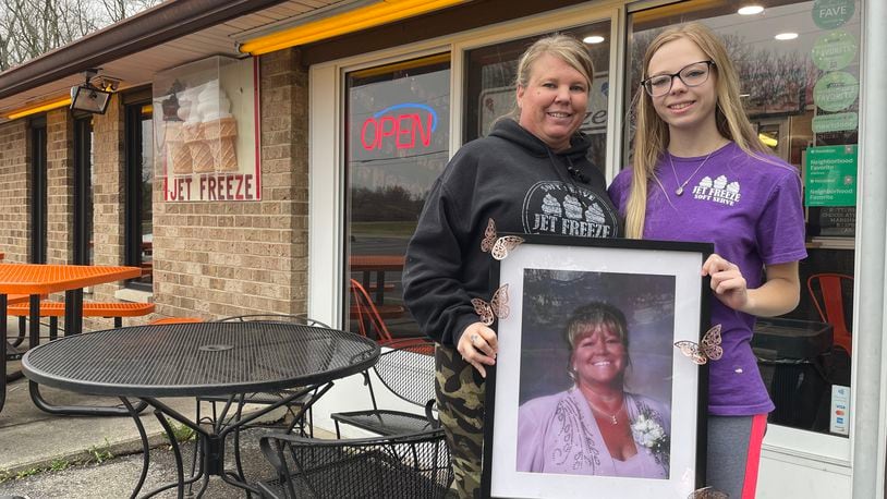 Jet Freeze, a Beavercreek staple since 1961, has reopened for the season. Pictured is Owner Brandi Bodey and her daughter, Makayla Mantia. They are holding a photo of Bodey's mom, Bonnie Mantia, who previously owned Jet Freeze. NATALIE JONES/STAFF