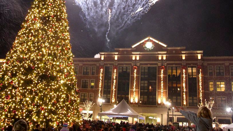 A display from Prestige Fireworks begins at the same time the tree comes on during the Santa parade and tree lighting celebration at The Greene towne square in Beavercreek, Saturday, November 19, 2011.