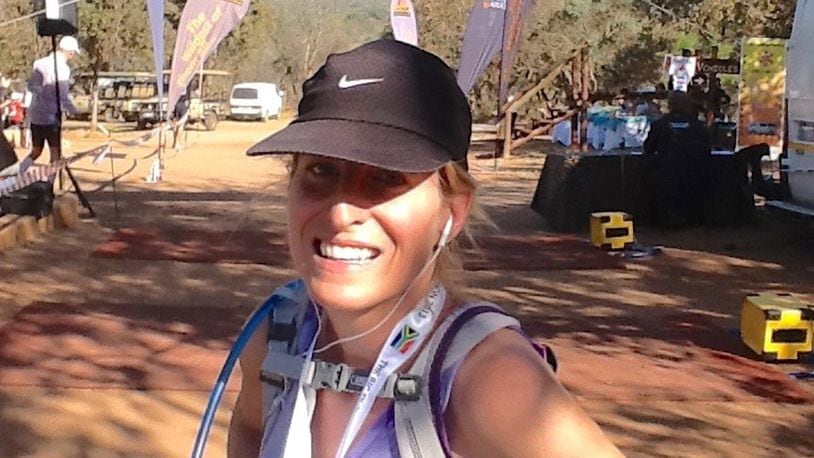 Kettering Fairmont grad Carla (Beyer) Higgins finishes the marathon in Africa, her third marathon continent, in 2013. CONTRIBUTED