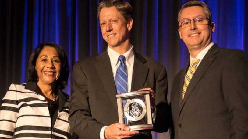 Mike Manzler, associate general counsel at Wright State University, received the 2018 Ruth W. and Robert I. Westheimer Award for Continuous United Way Leadership. He is pictured with Yvonne Gray Washington, retired executive vice president and COO of United Way of Greater Cincinnati, left, and Thomas Vaughan, chair of the Volunteer Connection Leadership Council.