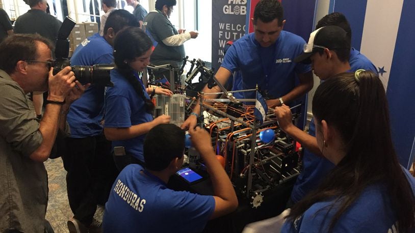 The Honduran robotics team makes repairs to the climbing arm of their robot before one of their matches at the FIRST Global Robotics Competition in Washington, D.C. CONTRIBUTED