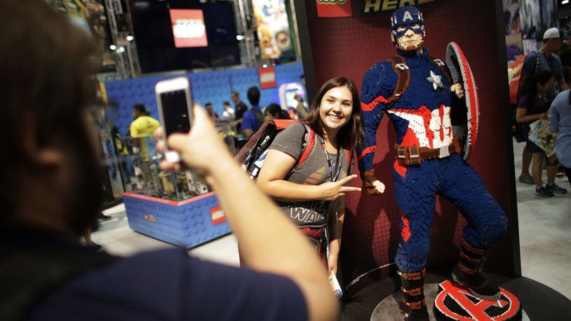 Danah Hernandez is photographerd by Gonzalo Glicia next to a Lego sculpture of Captain America at the Comic Con International in San Diego in July 2016. San Diego Comic-Con International will open a museum of popular culture in nearby Balboa Park. (Robert Gauthier/Los Angeles Times/TNS)