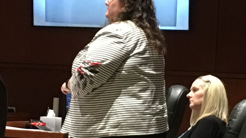 Former Springboro teacher Amy Panzeca listens as lawyer Andrea Ostrowski questions witnesses in court Wednesday, Aug. 8, 2018, in Lebanon. LAWRENCE BUDD/STAFF