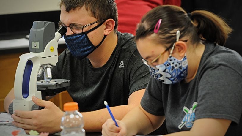Beavercreek High School students work in a science class Thursday, Oct. 8, 2020.