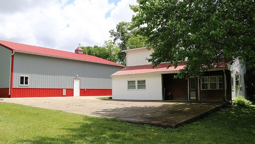 A concrete driveway starts at the gated entry and wraps around to the back of the house to a patio that has views of pastures and trees. The 3-acre secluded property includes a Cleary barn with 3 overhead doors, office, bathroom and loft storage.