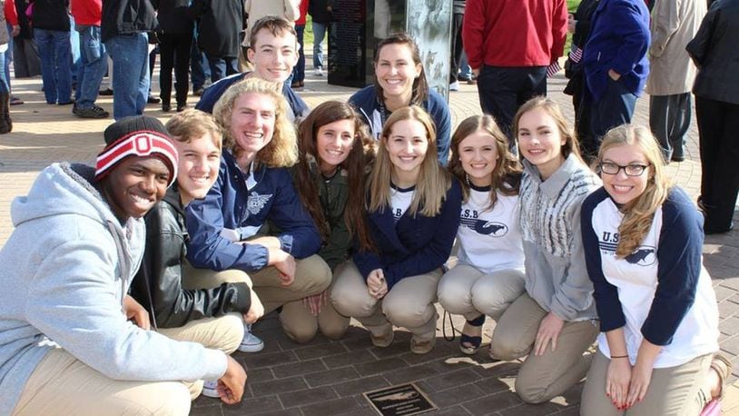 Kettering Fairmont United Student Body members attend the Veteran’s Memorial dedication at Delco Park in November. Pictured, front (from left): Thomas Siafa Jr., Noah Kihn, Ben Kelley, Katie Breslin, Emma Nichols, Olivia Priske, Emily Kennebeck and Reilly Corbett; In back (from left) are Ethan Crago and Corey Miller, faculty advisor. Not pictured: Audrey Albright. CONTRIBUTED