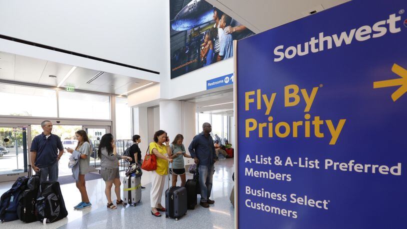 A line of passengers at the Southwest Airlines ticket counter on July 21, 2016, in Los Angeles. The nation&apos;s largest domestic carrier, Southwest is planning to add routes to Hawaii, and market shifts are likely in store. (Al Seib/Los Angeles Times/TNS)