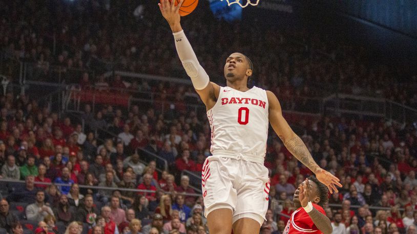 Dayton's Elijah Weaver scores an easy layup in Saturday's win over Northern Illinois at UD Arena. Jeff Gilbert/CONTRIBUTED
