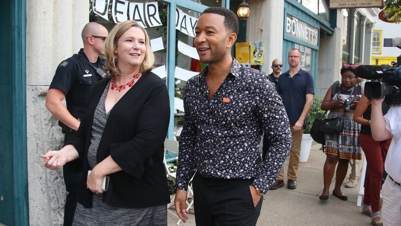 Dayton Mayor Nan Whaley and singer John Legend tour Dayton’s Oregon District on Aug. 11, 2019. Legend grew up nearby in Springfield and returned to Dayton to visit and shop in the district one week after a mass shooting claimed 10 lives. Legend later performed at a tavern for an invited audience of first responders and people affected by the shooting.