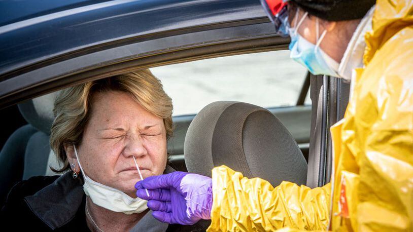 Jericho, N.Y.: Coronavirus testing continues at the ProHealth testing centers in Jericho, New York on April 22, 2020. Here, a healthcare worker tests a woman waiting in a car.
