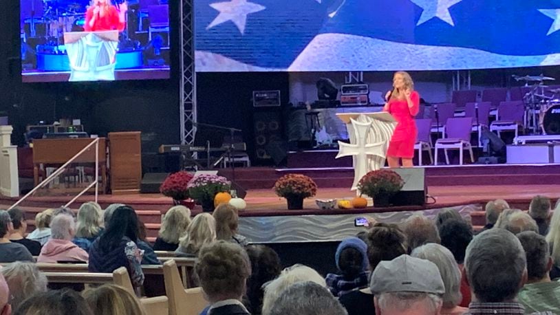 Jenna Ellis, an attorney known for working on former president Donald Trump's legal team, addresses a rally at Solid Rock Church in Lebanon on Oct. 25, 2021.