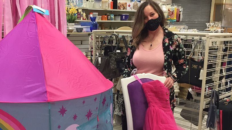 Thrift Shop manager Beth Newberry prepares a display of children’s items. The Wright-Patterson Officers’ Spouses’ Club consulted with the 88th Medical Group’s Public Health Flight and instituted a number of COVID-19 measures before reopening the shop. SKYWRIGHTER PHOTO/AMY ROLLINS