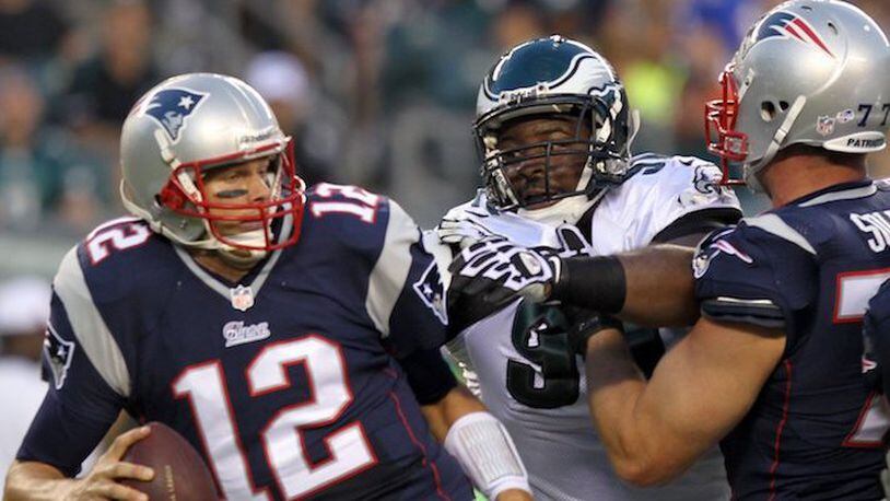 The Philadelphia Eagles' Fletcher Cox goes past the New England Patriots' Nate Solder, right, en route to quarterbak Tom Brady (12) in the first quarter in preseason action at Lincoln Financial Field in Philadelphia, Pennsylvania, on Friday, August 9, 2012. (Yong Kim/Philadelphia Daily News/MCT)