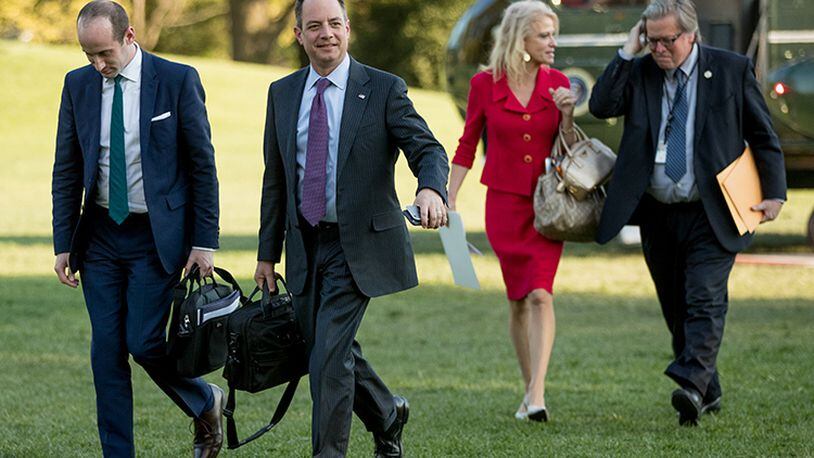 From left, President Donald Trump's White House Senior Adviser Stephen Miller, President Donald Trump's Chief of Staff Reince Priebus, Counselor to the President Kellyanne Conway, and President Donald Trump's White House Senior Adviser Steve Bannon, walk across the South Lawn after President Donald Trump arrives at the White House in Washington, Tuesday, April 18, 2017, after a short trip from Andrews Air Force Base, Md., after speaking at Snap-On Tools in Kenosha, Wis.