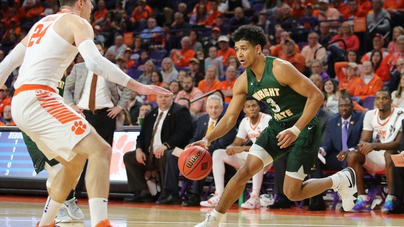 Wright State’s Mark Hughes drives against Clemson’s David Skara during Tuesday’s NIT game at Littlejohn Coliseum. CONTRIBUTED