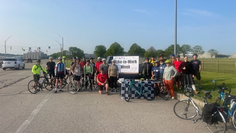 Employees at Wright-Patterson Air Force, celebrating a chance to bike to work, near gate 1B off Springfield Street early Tuesday. Photo by Maj. Michael Ford.