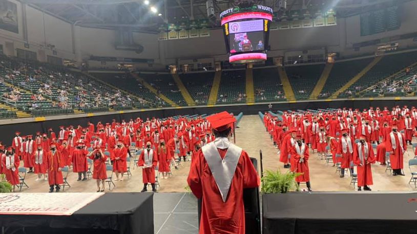Members of the Stebbins High School Class of 2021 stand for a speech at their graduation ceremony at the Nutter Center. Contributed photo by Mad River Local Schools