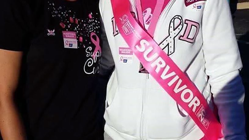 Jami Lanich (right) and her sister, Jodi Biles (left), walk together at a recent American Cancer Society Making Strides Springfield event. Lanich and her mother were both diagnosed with breast cancer in 2012, and Biles and the entire family supported them. CONTRIBUTED
