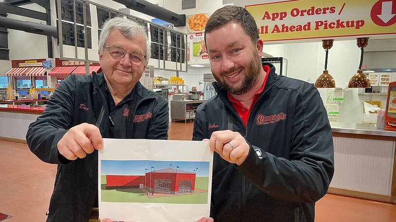 After more than a decade of ideas, Young’s Jersey Dairy has decided to add a carousel and an imagination space for children to a new building that will be constructed on the property. Pictured is Dan Young and his son, John.