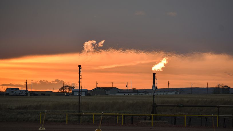 Flares burn natural gas from oil production in the Fort Berthold Indian Reservation east of New Town, North Dakota, May 18, 2021.  (AP Photo/Matthew Brown, File)
