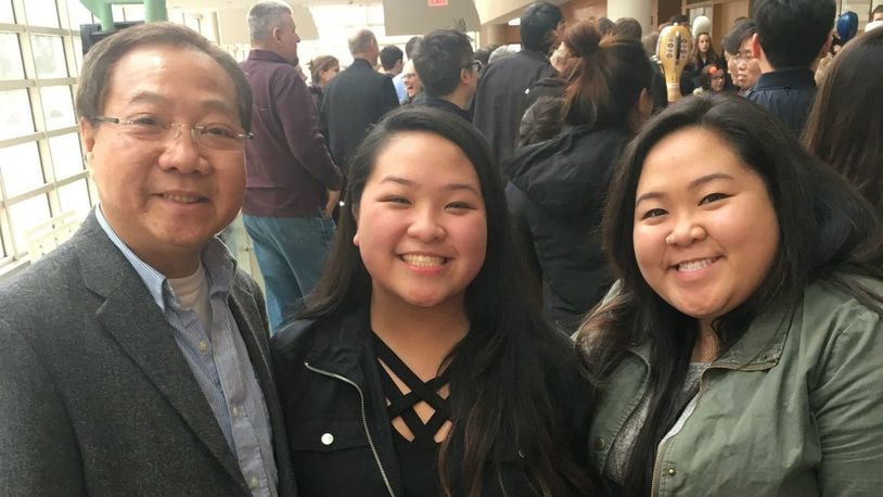 Thanh Huynh with his daughters Lana (middle) and Karen (right). CONTRIBUTED
