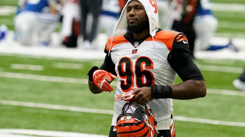 Cincinnati Bengals' Carlos Dunlap (96) walks off the field following an NFL football game against the Indianapolis Colts, Sunday, Oct. 18, 2020, in Indianapolis. (AP Photo/Michael Conroy)