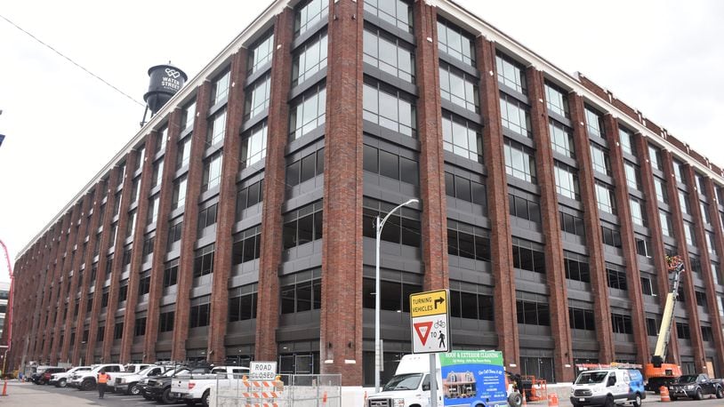 Parts of the Delco building are expected to open around June, including about 30 of its 160 apartments and the 482 public parking spaces. The Delco is a massive, mixed-use development located just south of the Day Air Ballpark, where the Dayton Dragons play baseball in downtown Dayton. CORNELIUS FROLIK / STAFF
