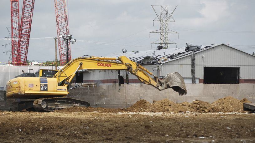 Contractors are in the final stages of demolishing the remains of the Frito Lay distribution center on Troy Street that was destroyed by the Memorial Day tornado. TY GREENLEES / STAFF