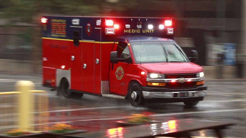 A Springfield Fire Division medic unit races through the rain in route to a call in this July 6, 2023, photo. BILL LACKEY/STAFF