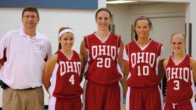 In a 2010 photo, Jim Dabbelt, left, is pictured with Allie Turner (Greenon), Cassie Sant (Fairmont), Courtney Boyd (Brookville) and Kacie Cassell (Vandalia Butler) after Ohio routed Kentucky 84-55 in the 19th annual Ohio-Kentucky All-Star game at Thomas More College.