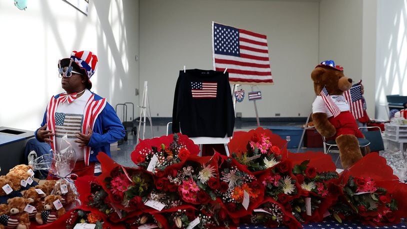 A vendor sells patriotic merchandise during a naturalization ceremony held by U.S. Citizenship and Immigration Services at the Los Angeles Convention Center on February 15, 2017 in Los Angeles, California. (Photo by Justin Sullivan/Getty Images)