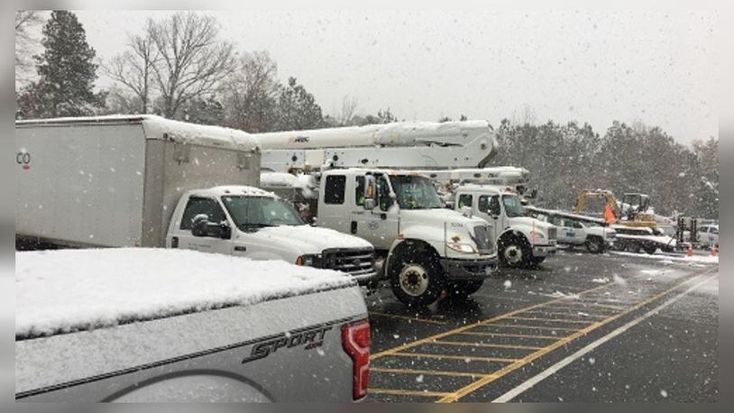 Dayton Power & Light crews stage in Durham, North Carolina, Dec. 10, 2018, for power restoration efforts for Duke Energy. A massive snowstorm knocked out power across the southeast and is blamed for at least three deaths.