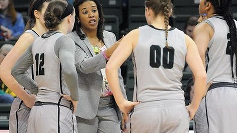 Wright State women’s basketball coach Katrina Merriweather talks to some of her players during a game earlier this season . Tim Zechar/Contributed photo