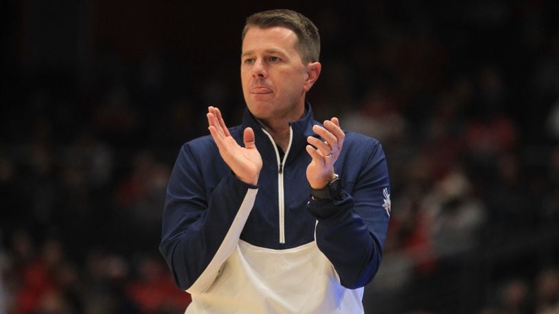 Cedarville coach Pat Estepp claps during a game against Dayton in an exhibition game on Monday, Nov. 1, 2021, at UD Arena. David Jablonski/Staff