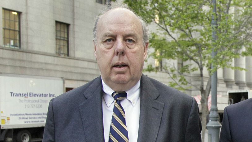 In this April 29, 20111, file photo, attorney John Dowd walks in New York.