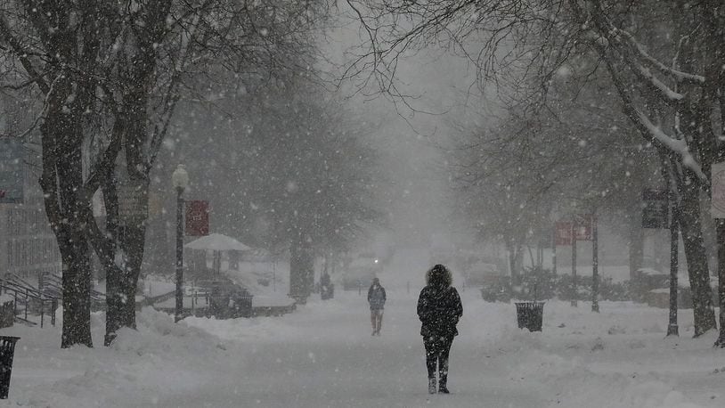 Wittenberg University will operate remotely on Thursday due to winter storm. Here, students walked through the snow on the Wittenberg University campus last year during a snow storm. BILL LACKEY/STAFF