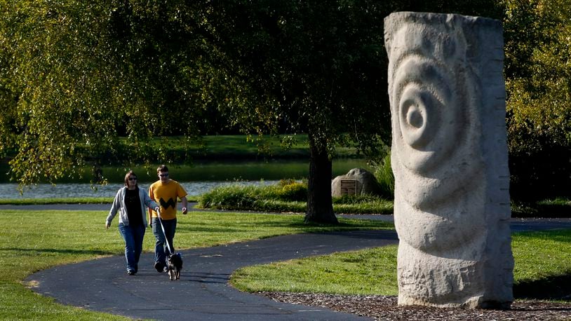 "Rock Waves" created from Indiana limestone by the artist Anno Sieberts, can be found in Kettering's Delco Park. LISA POWELL / STAFF