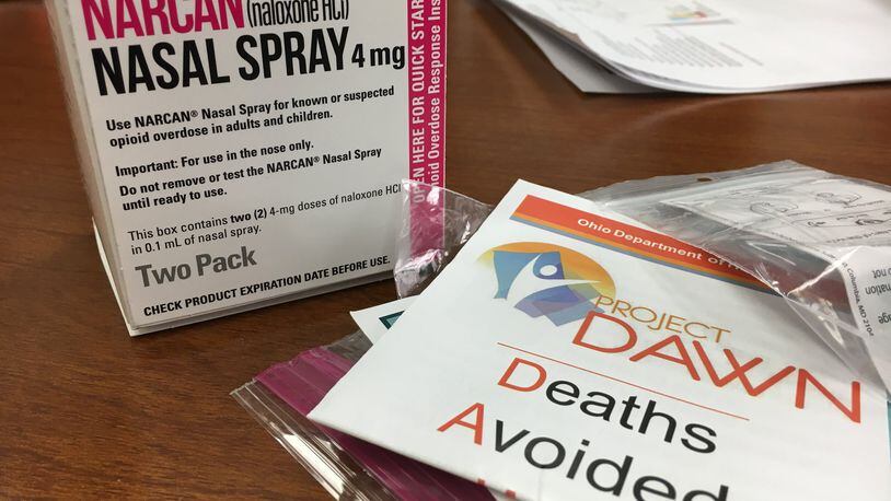 Each naloxone kit distributed by Project DAWN includes a nasal spray device with two doses of 2 mg each of the overdose-reversing drug. Wider distribution of naloxone is one of the proposed solutions presented to state officials Monday at a meeting with media representatives from the organization Your Voice Ohio. KATIE WEDELL/STAFF