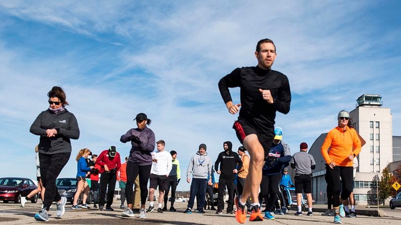 Participants take off from the starting line Nov. 18 during the Turkey Trot 5K Fun Run at Wright-Patterson Air Force Base. Due to COVID-19 restrictions, runners were released in waves of 10 to help with physical distancing. U.S. AIR FORCE PHOTO/WESLEY FARNSWORTH