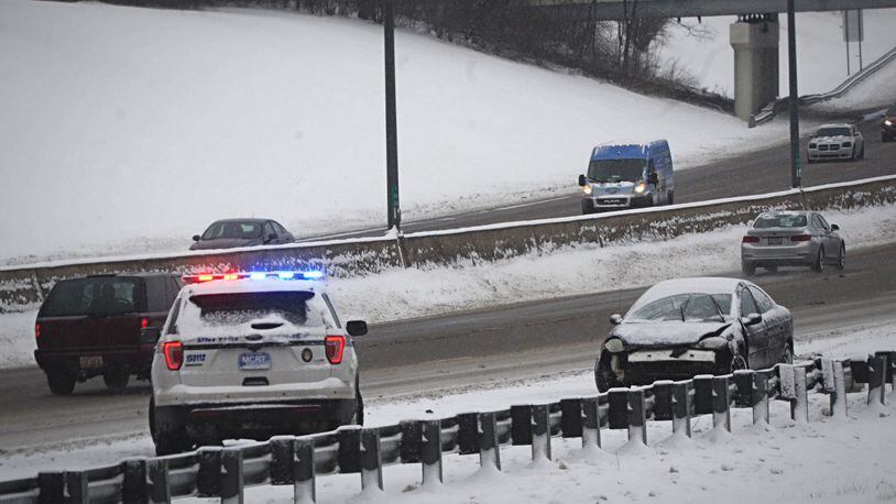 Slide outs were familiar sight early Thursday morning on Feb. 18, 2021. 
This motorist slid off US 35 east near downtown Dayton. MARSHALL GORBY\STAFF