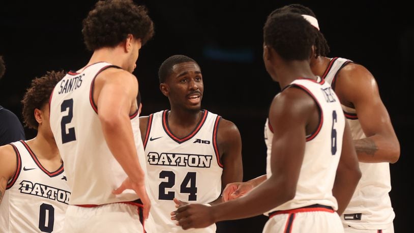 Dayton's Kobe Elvis talks to teammates during a game against Duquesne in the Atlantic 10 Conference tournament quarterfinals on Thursday, March 14, 2024, at the Barclays Center in Brooklyn, N.Y. David Jablonski/Staff