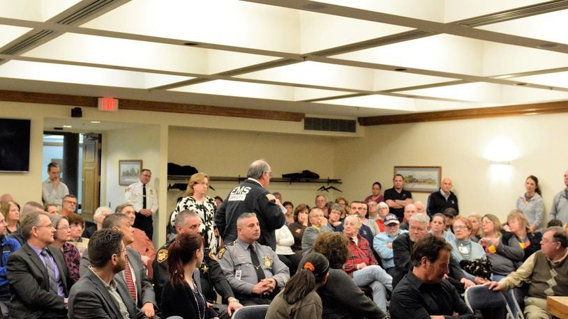 Tipp City EMS Chief Jeff Calicoat answers questions about use of Narcan on overdose victims during a community forum on the heroin epidemic in March. CONTRIBUTED