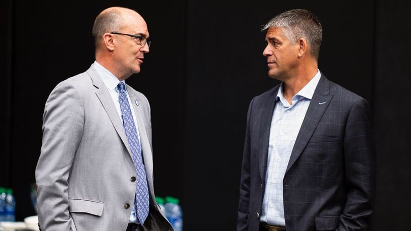 Duquesne Athletic Director Dave Harper, right, appears at A-10 Media Day on October 24, 2019 at Barclays Center, Brooklyn, New York.  (Photo by Mike Lawrence)