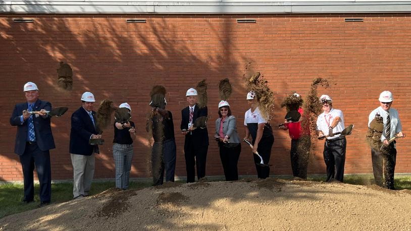 Stakeholders for the Wayne High School career technology expansion project, including Superintendent Jason Enix, center, broke ground Thursday. AIMEE HANCOCK / STAFF