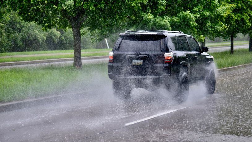 Heavy rains hit the area Monday, including this image taken near Carillon Park on Patterson. NICHOLAS GRAHAM/STAFF